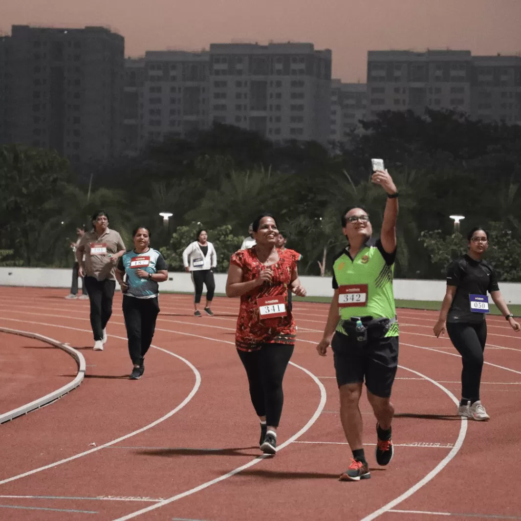 Participants running on the track field