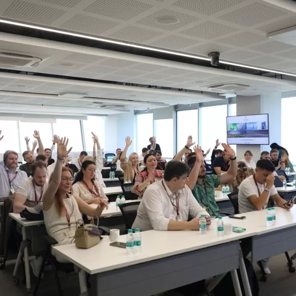 Students interacting with speaker in a session.