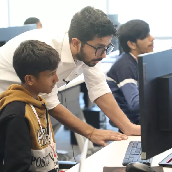 Faculty helping a student in the chatbot session